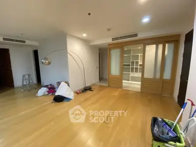 Spacious living room with wooden flooring and modern sliding doors