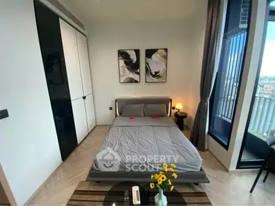 Modern bedroom with stylish decor and city view balcony