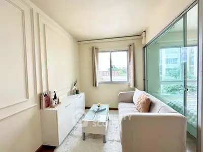 Bright and cozy living room with modern decor and large window view