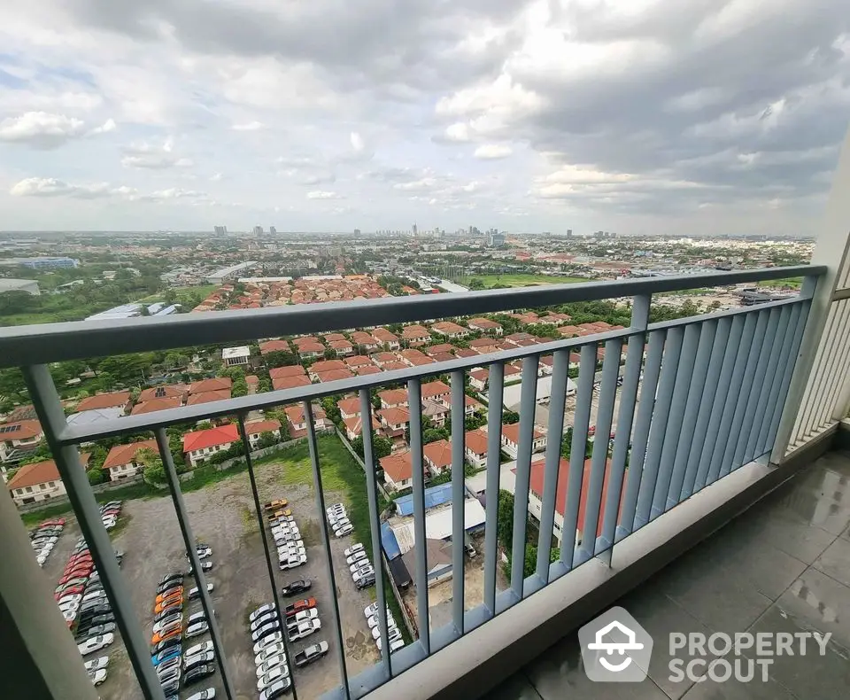 Stunning high-rise balcony view overlooking cityscape and residential area