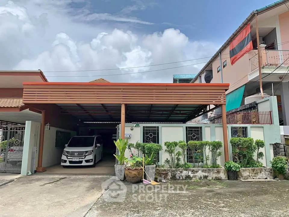 Charming suburban home with carport and lush greenery, perfect for family living.