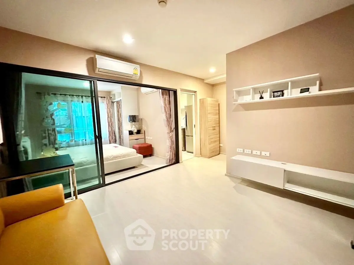 Modern apartment with open living space and cozy bedroom