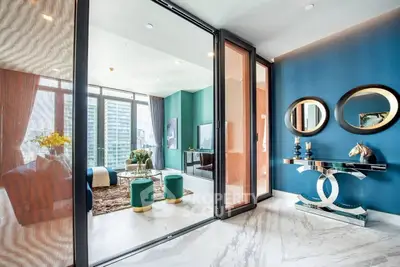 Luxurious modern living room with marble floors and stylish decor in a high-rise apartment.