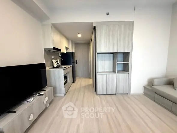 Modern apartment interior with sleek kitchen and cozy living area