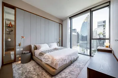 Luxurious bedroom with stunning city view and modern decor