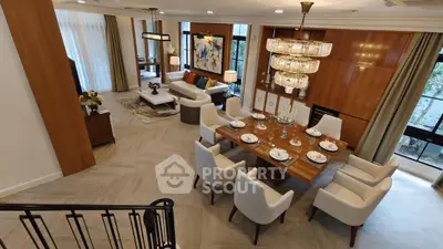 Luxurious open-plan living and dining area with elegant decor and modern furnishings.
