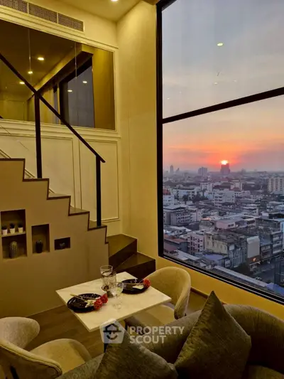 Luxurious duplex apartment with stunning city sunset view and elegant interior design.