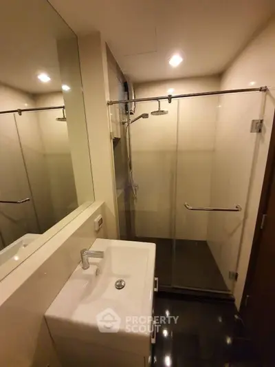 Modern bathroom with glass shower and sleek sink design