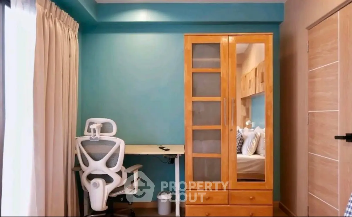 Modern study room with ergonomic chair and wooden cabinet, perfect for productivity.