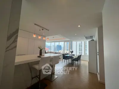 Modern open-layout kitchen and dining area with city view