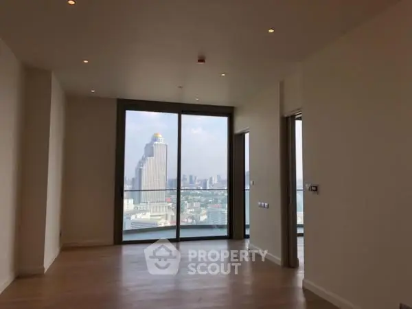 Spacious living room with stunning city view from high-rise apartment