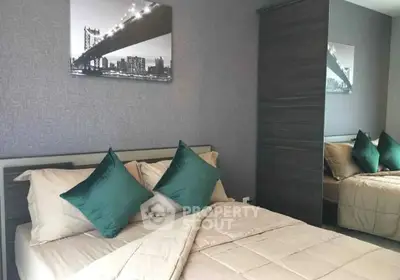 Modern bedroom with stylish decor and comfortable bedding in a contemporary apartment.