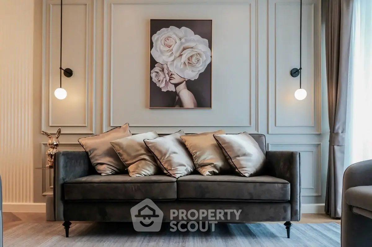 Elegant living room with plush sofa and artistic wall decor, perfect for modern interiors.