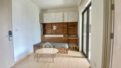 Modern minimalist living room with sleek wooden furniture and natural light