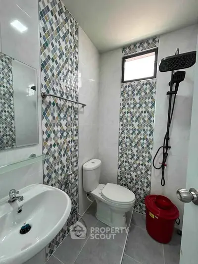 Modern bathroom with stylish tile design and rainfall showerhead