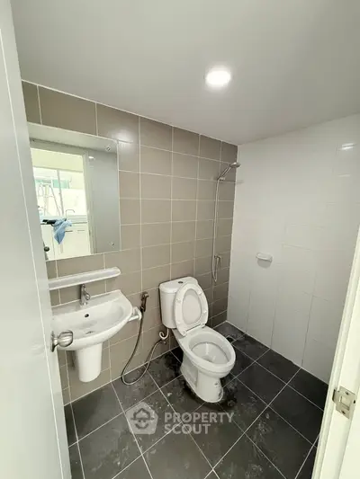 Modern bathroom with sleek tiles and contemporary fixtures