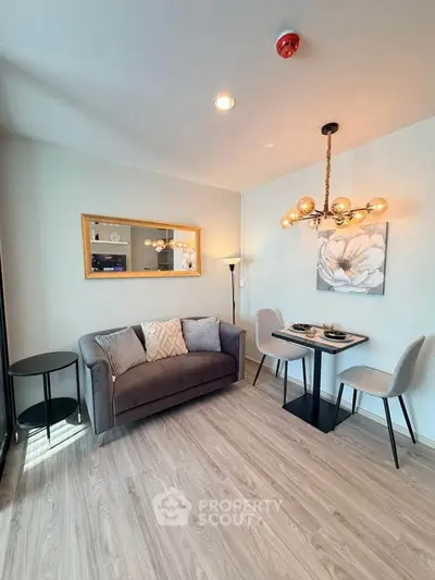 Chic modern living room with stylish decor and cozy dining area, perfect for urban living.