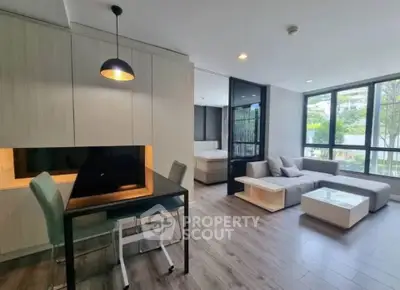 Modern open-plan living room with stylish furniture and natural light