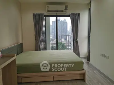 Modern bedroom with city view and balcony access in urban apartment