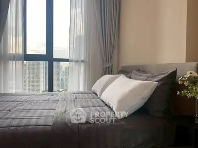 Luxurious bedroom with stunning city view and elegant decor