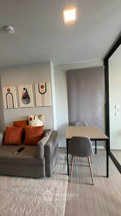 Modern living room with stylish decor and cozy seating area, perfect for relaxation and entertaining.