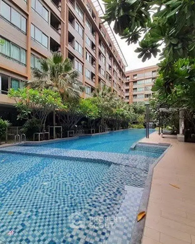 Luxurious condominium with stunning pool and lush greenery