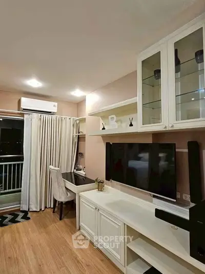 Modern living room with stylish decor and balcony access