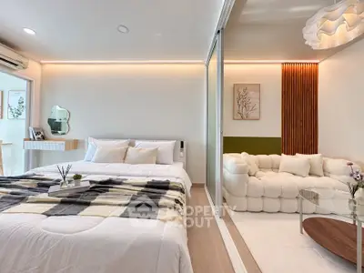 Modern bedroom with cozy seating area and stylish decor