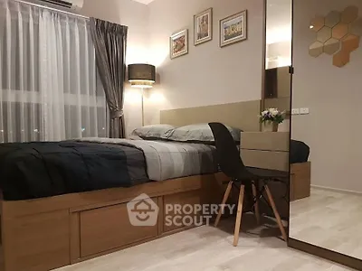Cozy modern bedroom with stylish decor and large window