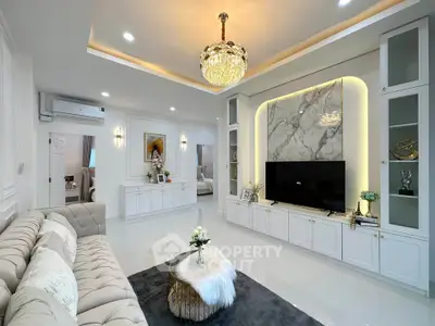 Luxurious living room with elegant chandelier and modern decor