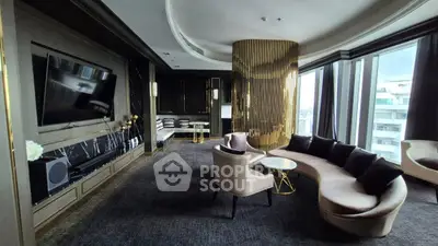 Luxurious living room with modern decor, large TV, and panoramic city views.