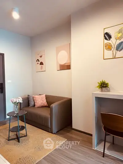 Cozy living room with modern decor and comfortable seating in a stylish apartment.