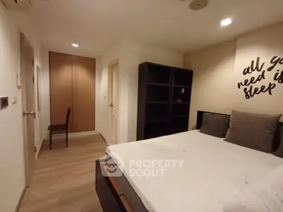 Cozy bedroom with modern decor and ample storage space