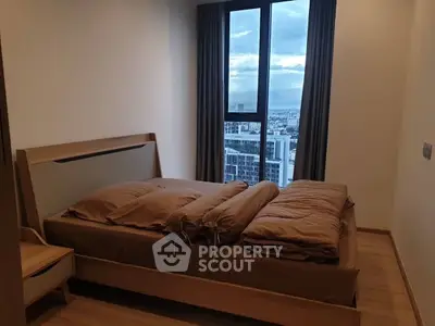 Modern bedroom with city view and stylish wooden furniture