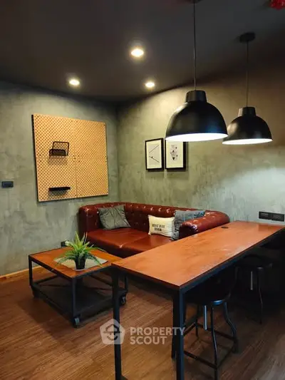 Stylish modern living room with industrial design and cozy seating area.