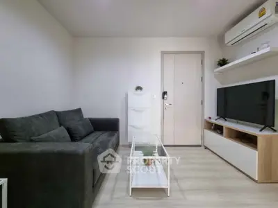 Modern living room with sleek furniture and air conditioning, perfect for cozy relaxation.