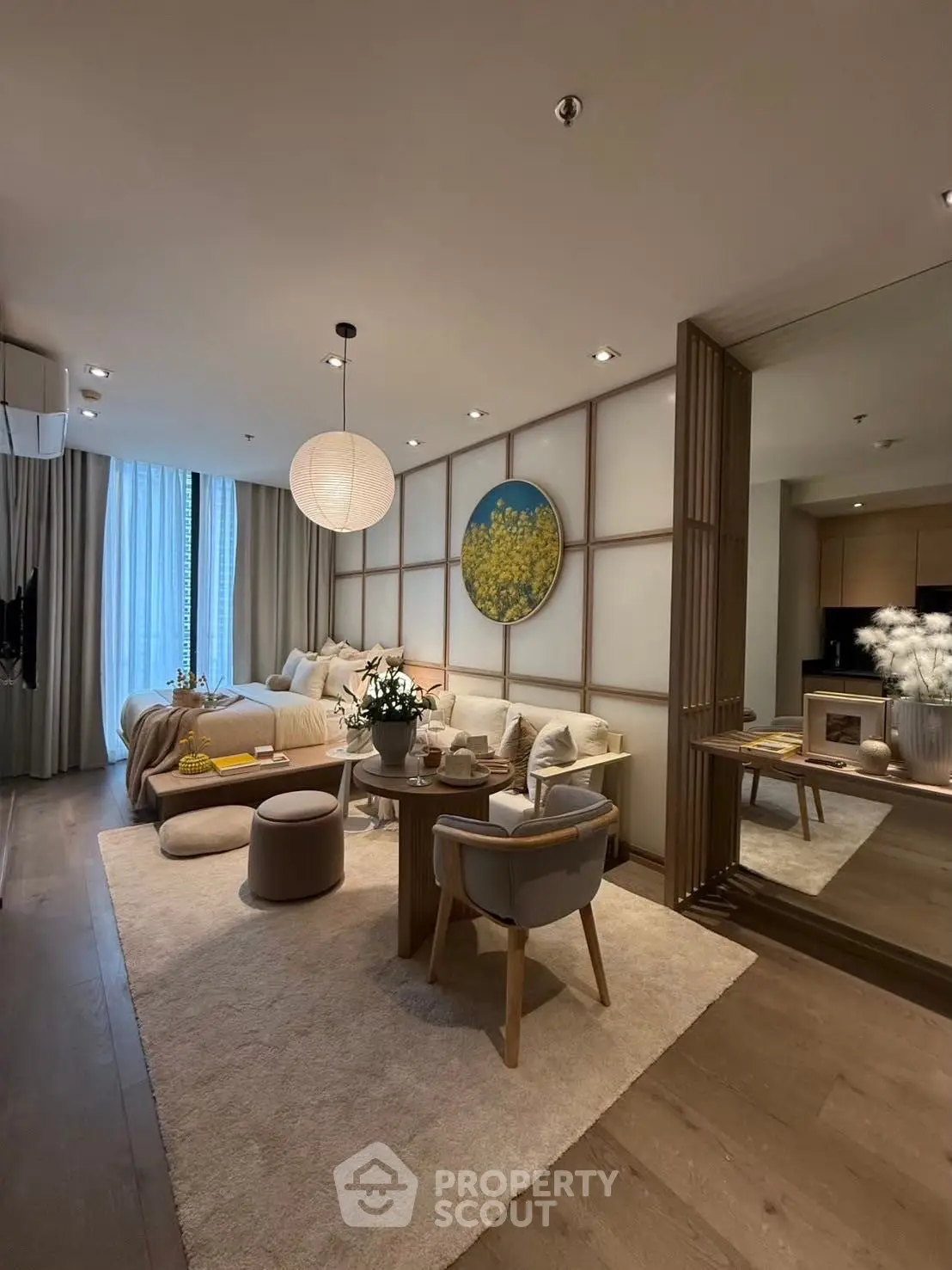 Luxurious modern living room with elegant decor and large window view.