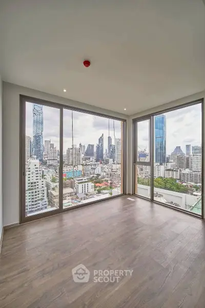 Stunning corner unit with panoramic city views and floor-to-ceiling windows.