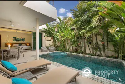 Luxurious private villa with pool and lush garden, perfect for relaxation and tropical living.