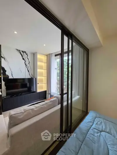 Modern living room with sliding glass doors and stylish decor
