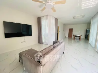 Spacious modern living room with sleek design and large windows