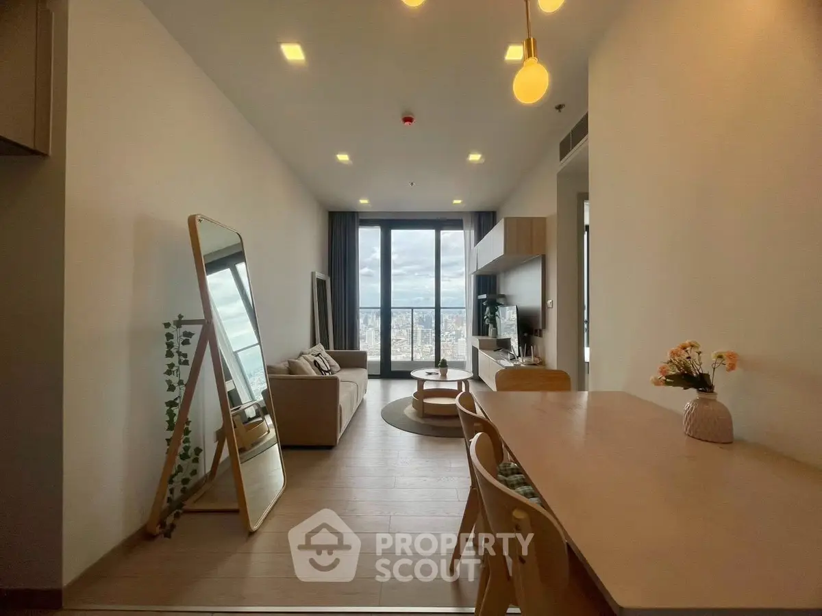 Modern living room with city view, stylish furniture, and elegant decor