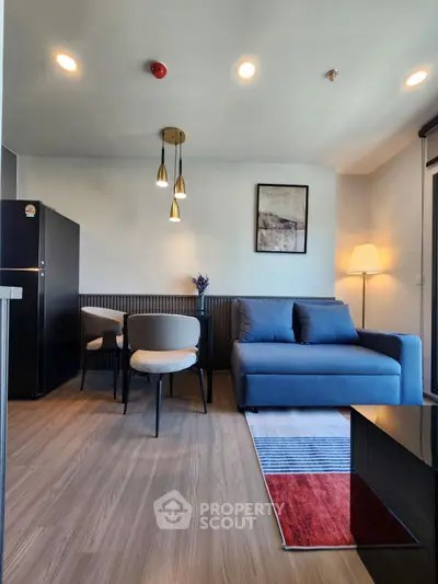 Modern living room with stylish furniture and elegant lighting