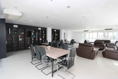 Spacious modern living room with sleek furniture and ample natural light
