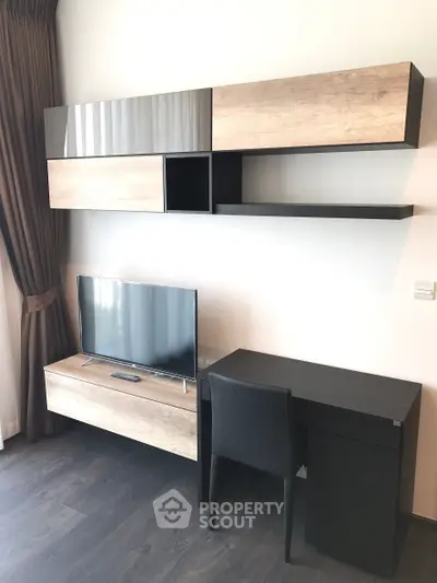 Modern living room with sleek TV unit and stylish desk setup