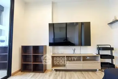 Modern living room with wall-mounted TV and stylish wooden furniture