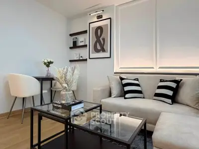 Stylish modern living room with elegant decor and cozy seating area.