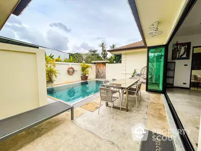 Luxurious villa with private pool and outdoor dining area in tropical setting