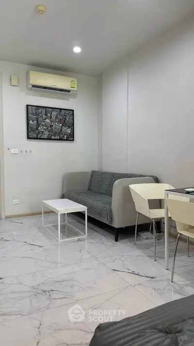 Modern living room with sleek marble flooring and contemporary furniture