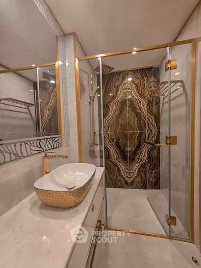 Luxurious bathroom with elegant marble shower and stylish sink